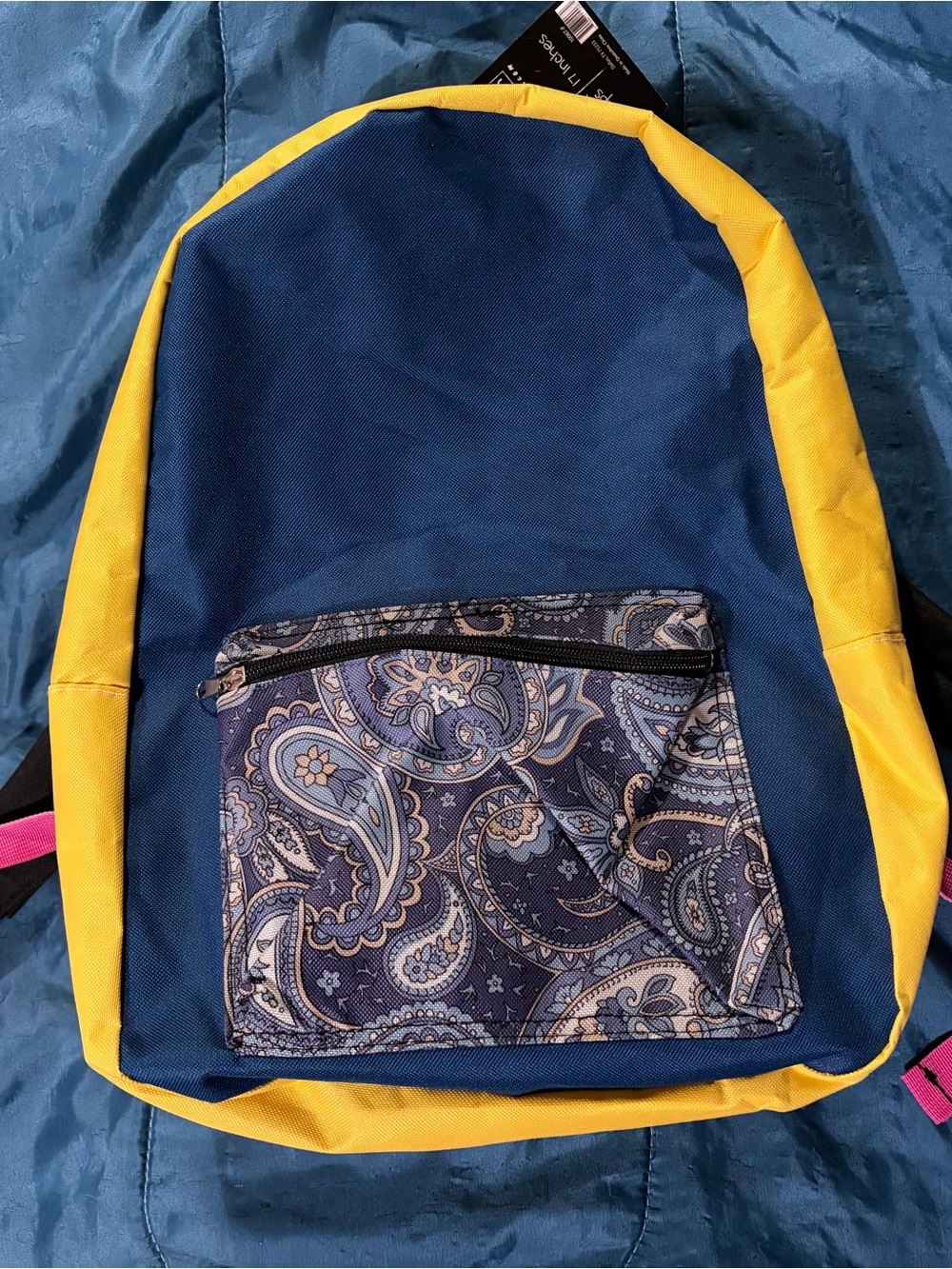 Navy blue and yellow Moda West backpack with paisley front pocket